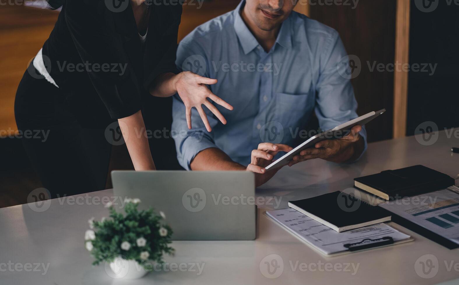 Business People Talking Discussing with coworker planning analyzing financial document data charts and graphs in Meeting and successful teamwork Concept photo