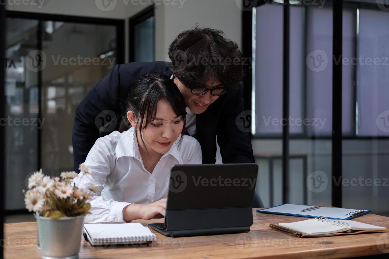 University asian students learning language using digital tablet and internet, working project together. Exam preparation. Online education concept. team of coworkers brainstorming. Meeting. Teamwork photo
