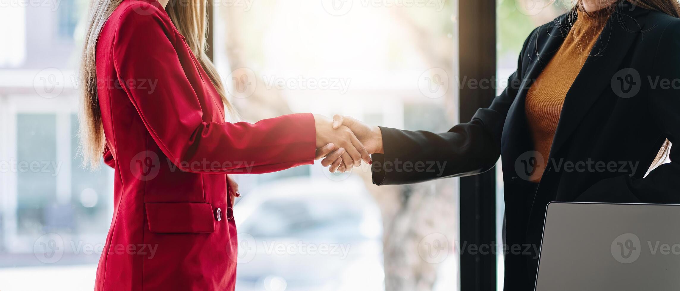 two businessman shake hands as hello in office closeup. Friend welcome, introduction, greet or thanks gesture, product advertisement, partnership approval, strike a bargain on deal concept photo