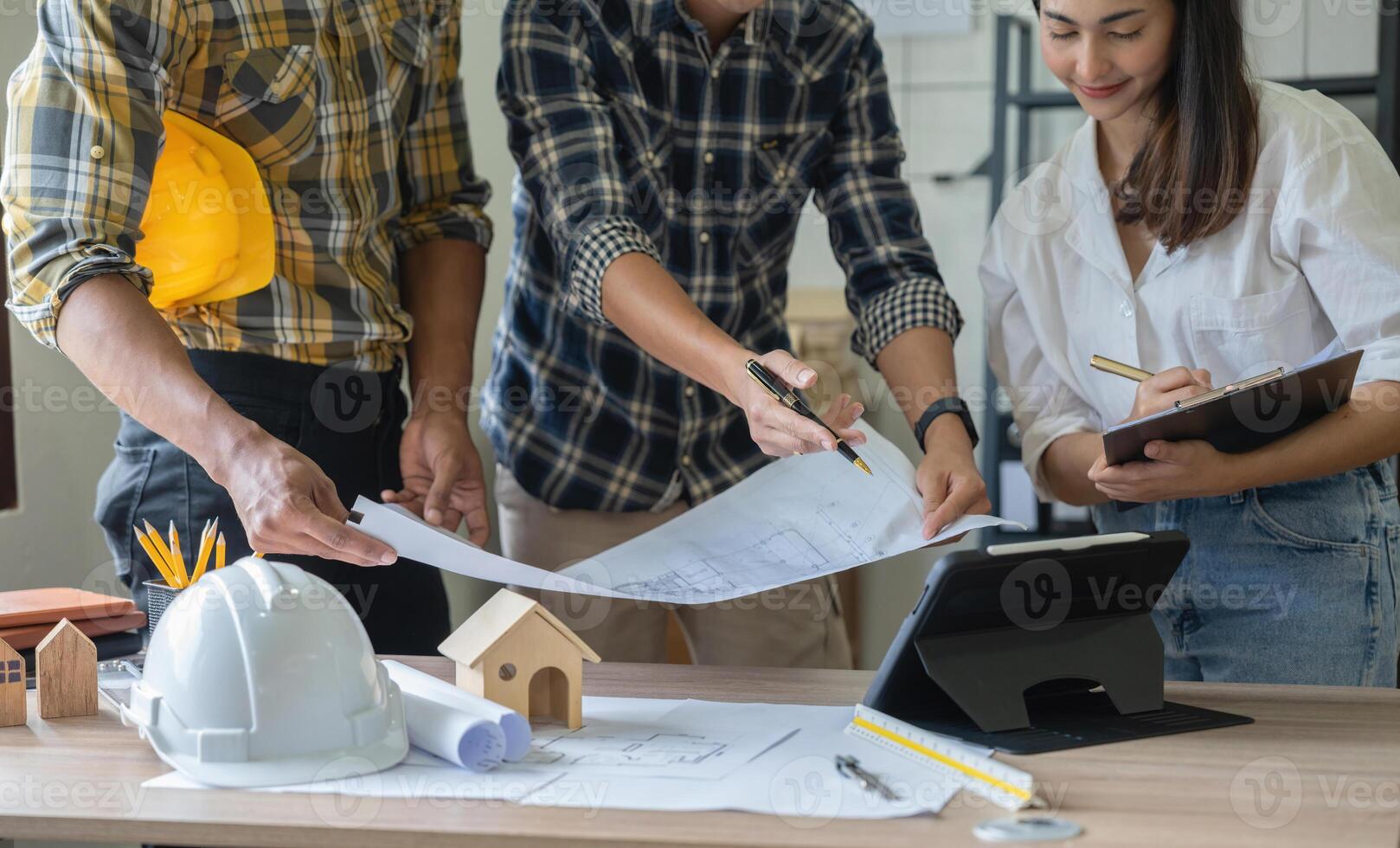 Group of engineer and architect working in office with blueprints, inspection in workplace for architectural plan, construction project, Business construction. photo