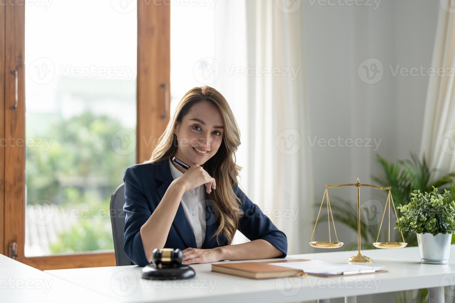 Business woman and lawyers discussing contract papers with brass scale on wooden desk in office. Law, legal services, advice, Justice and real estate concept. photo