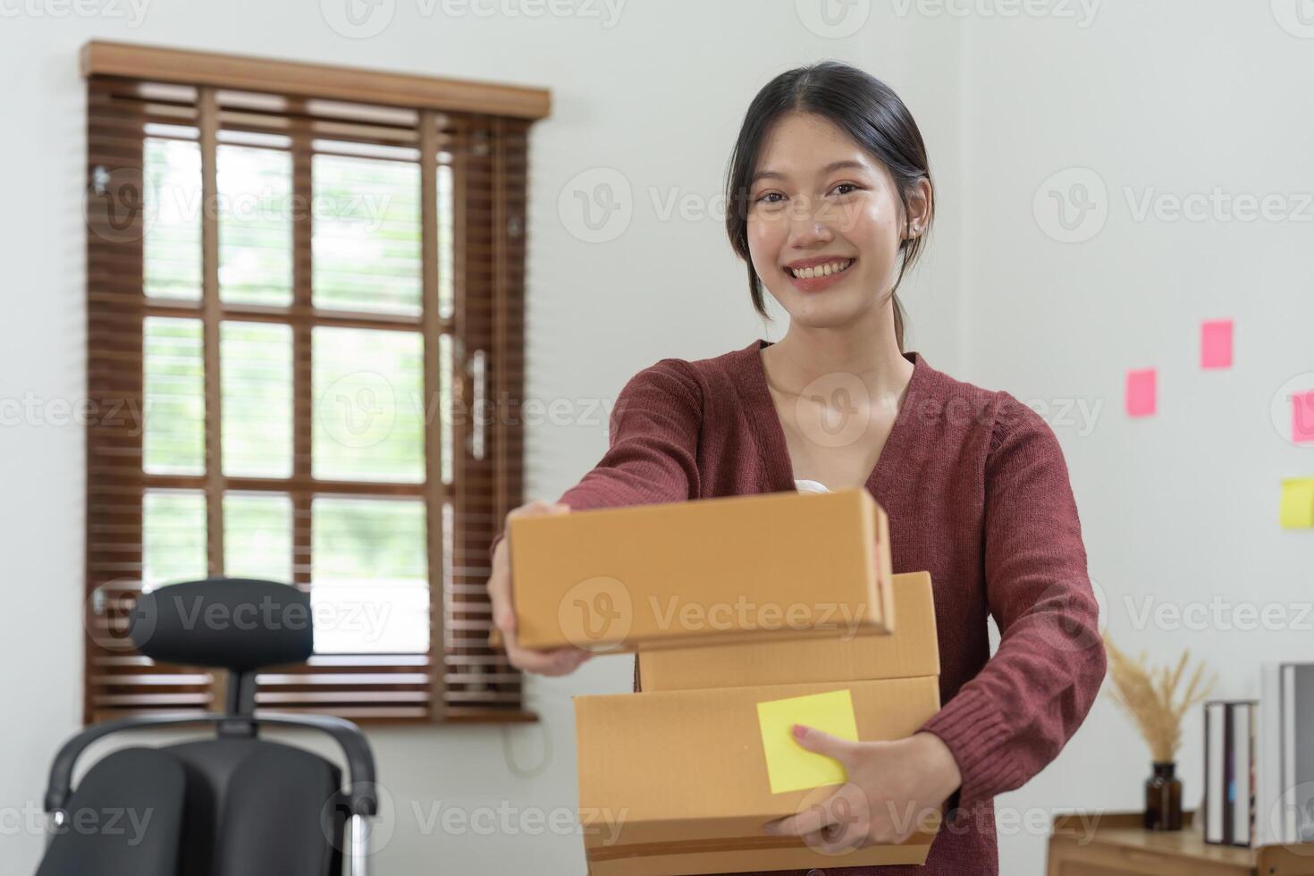 Portrait asian entrepreneur successful with her SME business. Online marketing packaging delivery, startup SME entrepreneur or freelance woman concept. Small business owner photo