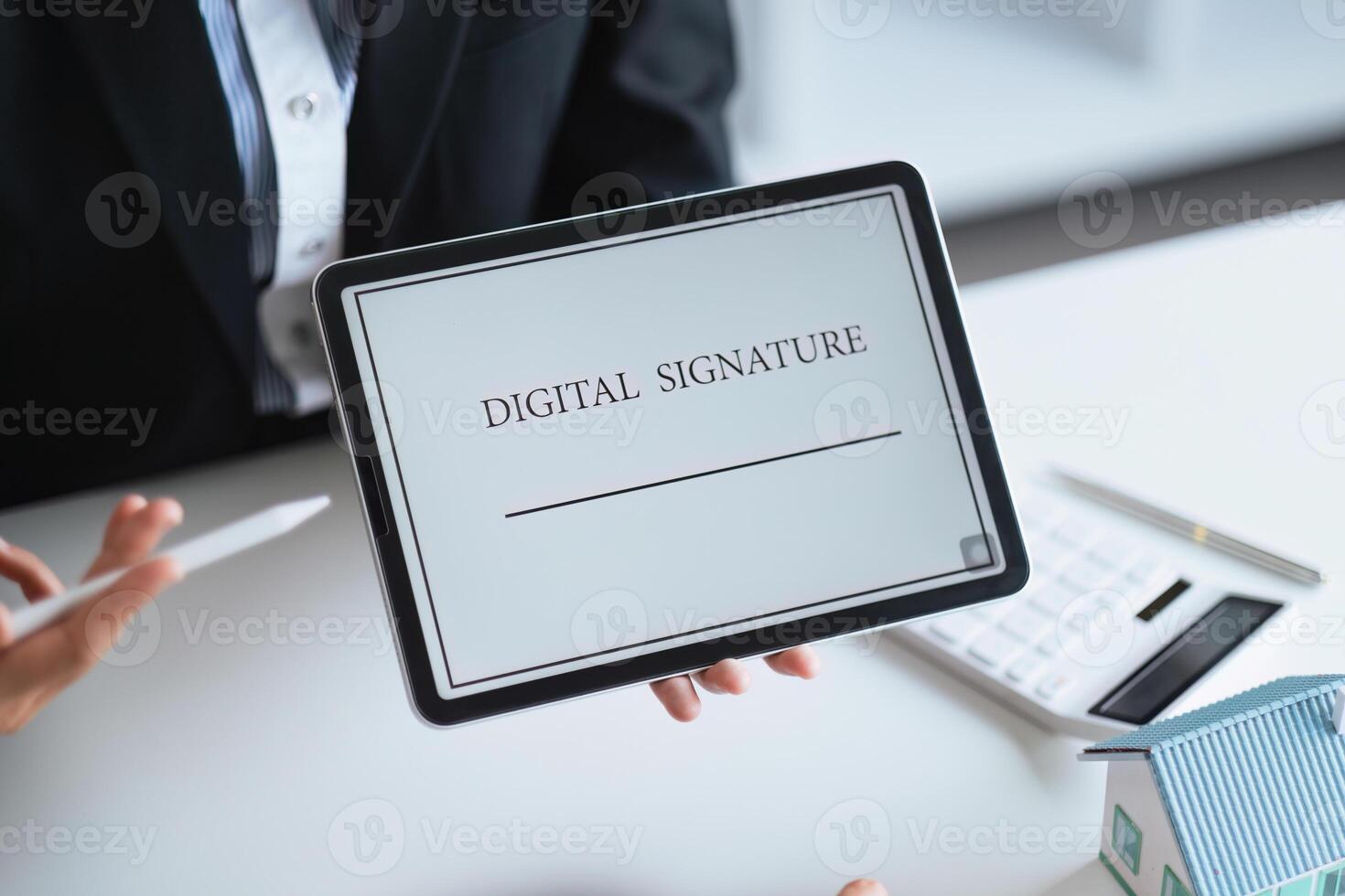 Close-up of female hand signing e-document with on tablet. Electronic signature and modern technologies concept photo