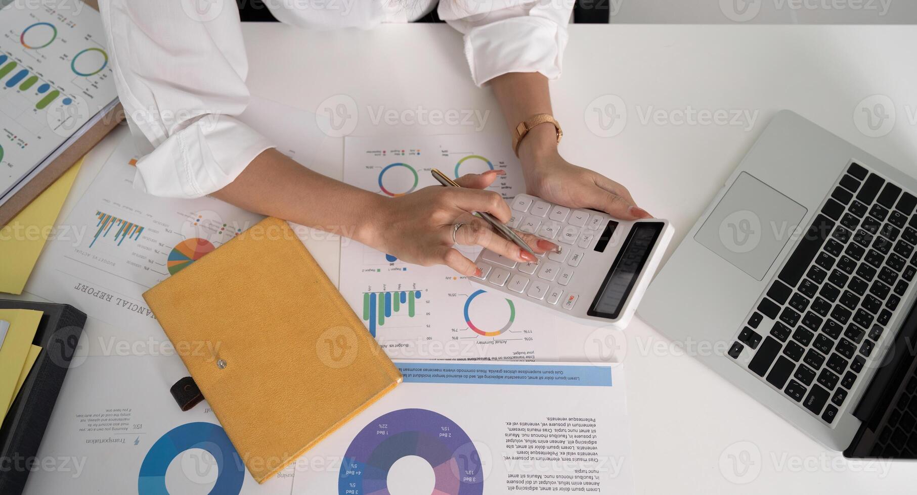 Businesswoman accountant using calculator and laptop for financial data saving in office room, Business financial, tax, accounting concept photo