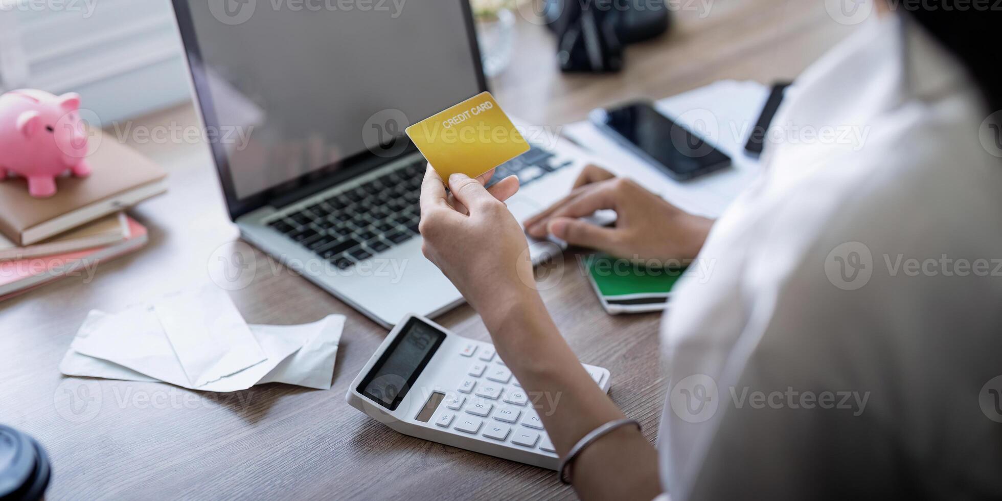 Woman on desk with laptop, credit card and ecommerce payment for online shopping at home. Happy female customer, digital bank app and sale on store website with internet banking photo