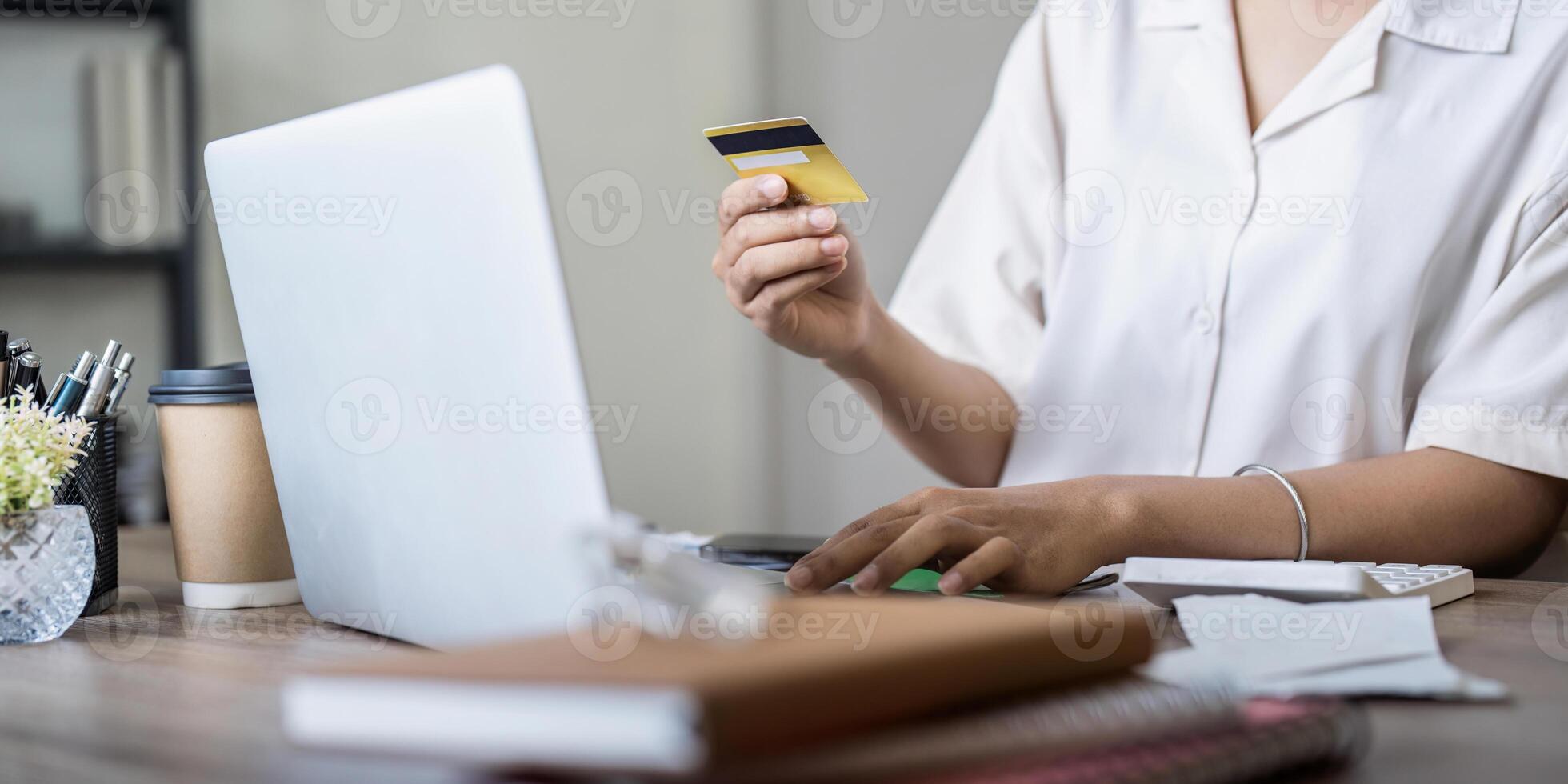 Woman on desk with laptop, credit card and ecommerce payment for online shopping at home. digital bank app and sale on store website with internet banking photo