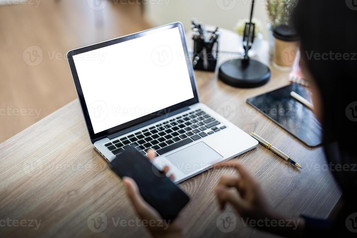 Mockup computer blank screen for hand typing text, using laptop contact business searching information in workplace on desk at office. design creative work space on desk photo