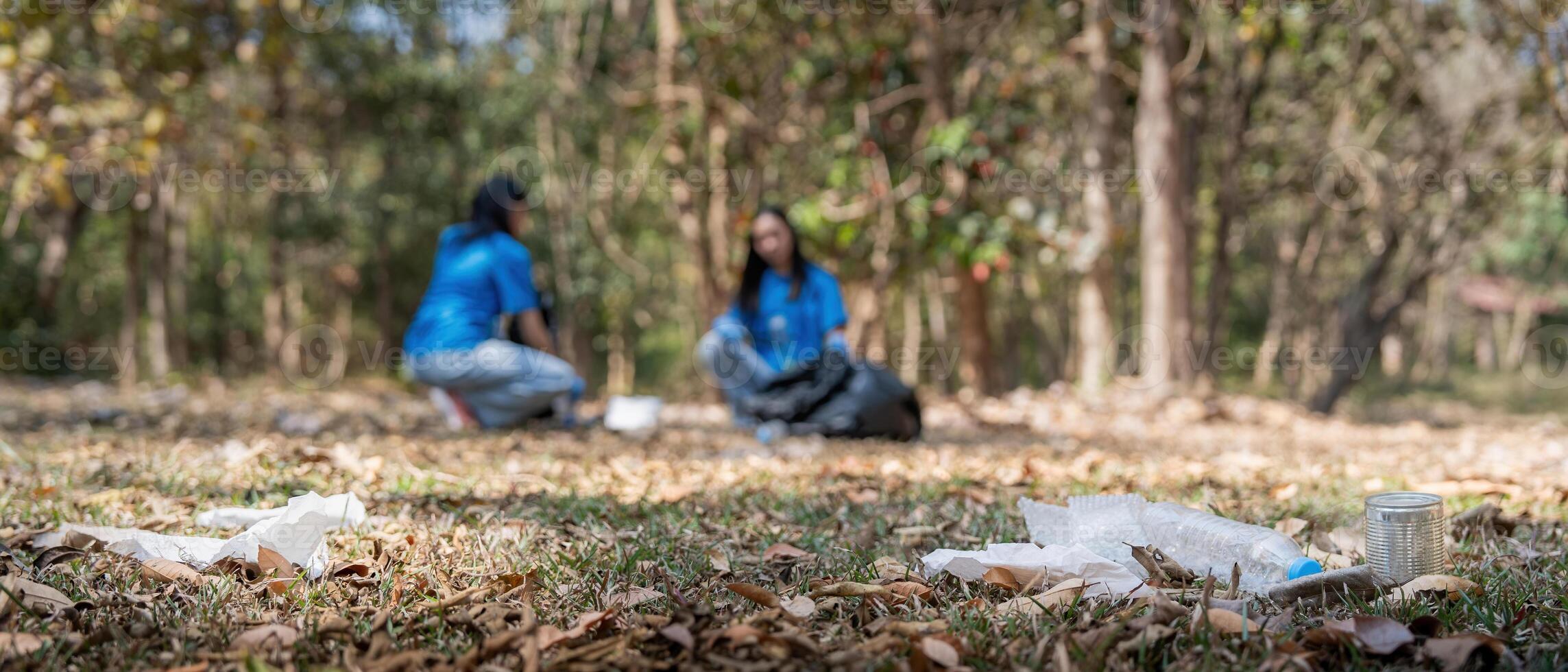 Garbage collect volunteer collect up plastic bottles put garbage at parks avoid pollution be friendly to the environmental and ecosystem photo