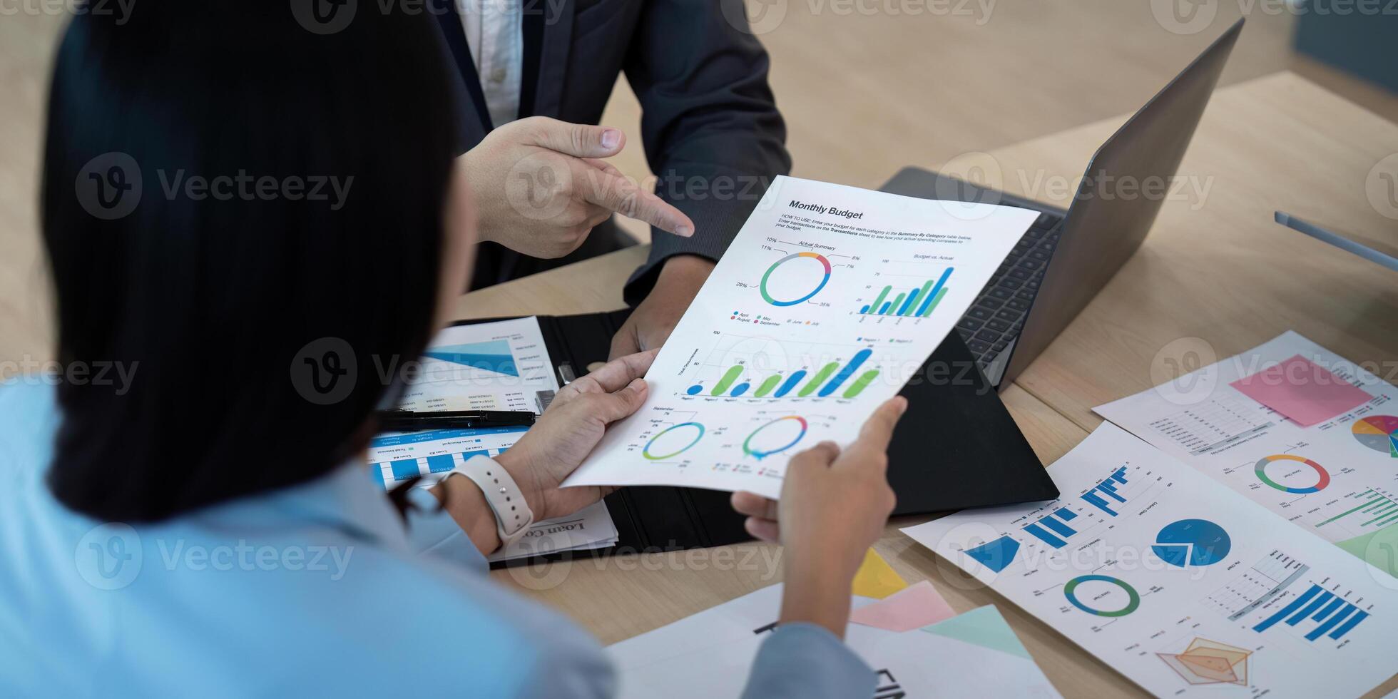 Business team analyzing financial report in modern office, strategy concept photo