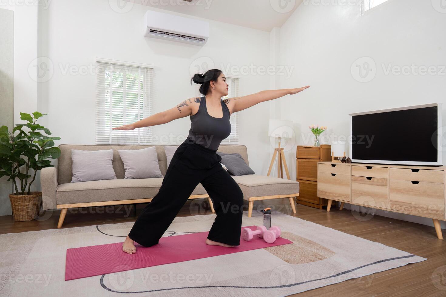 Inspirational Journey of a Plus Size Woman Practicing Yoga at Home, Embracing a Healthy Lifestyle and Weight Loss Transformation in a Modern Living Room Setting photo