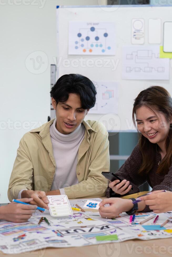 Creative UX Developer and UI Designer Brainstorming Session with Wireframes and Prototypes for Innovative Digital Solutions photo