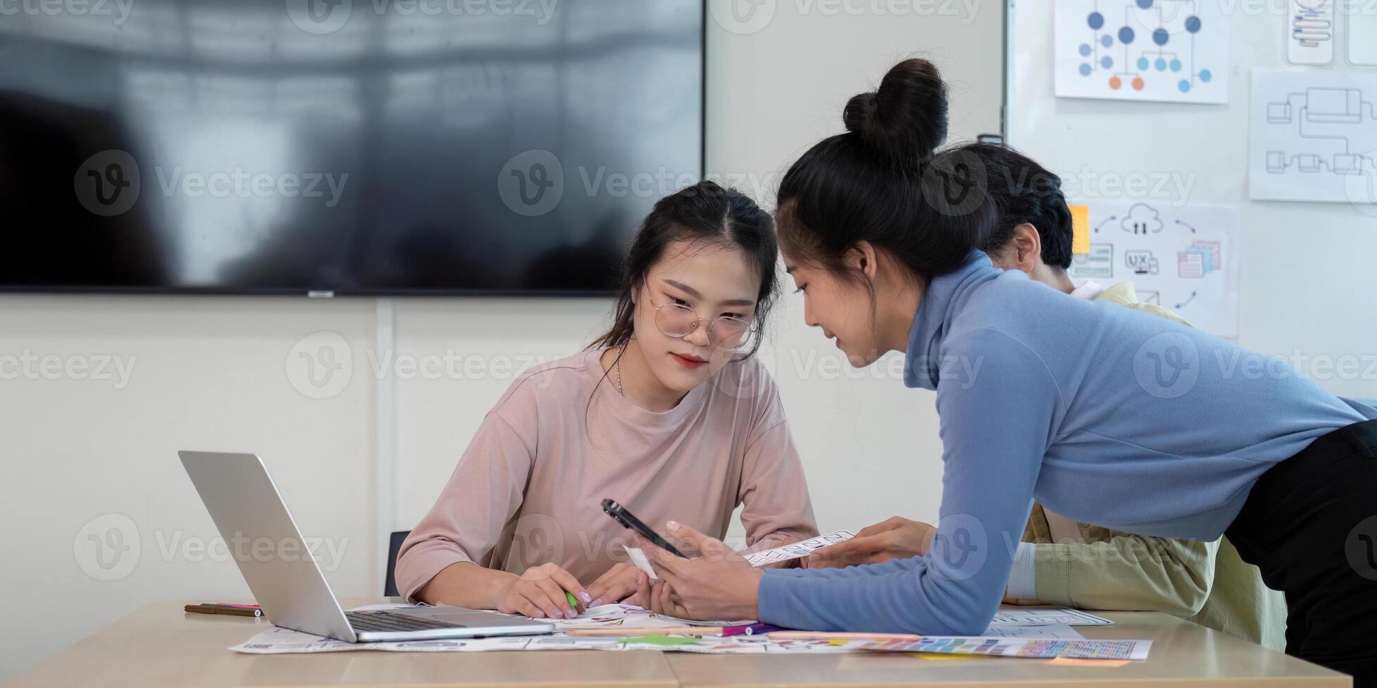 Creative UX Developer and UI Designer Brainstorming Session in Modern Office with Digital Devices and Design Prototypes photo