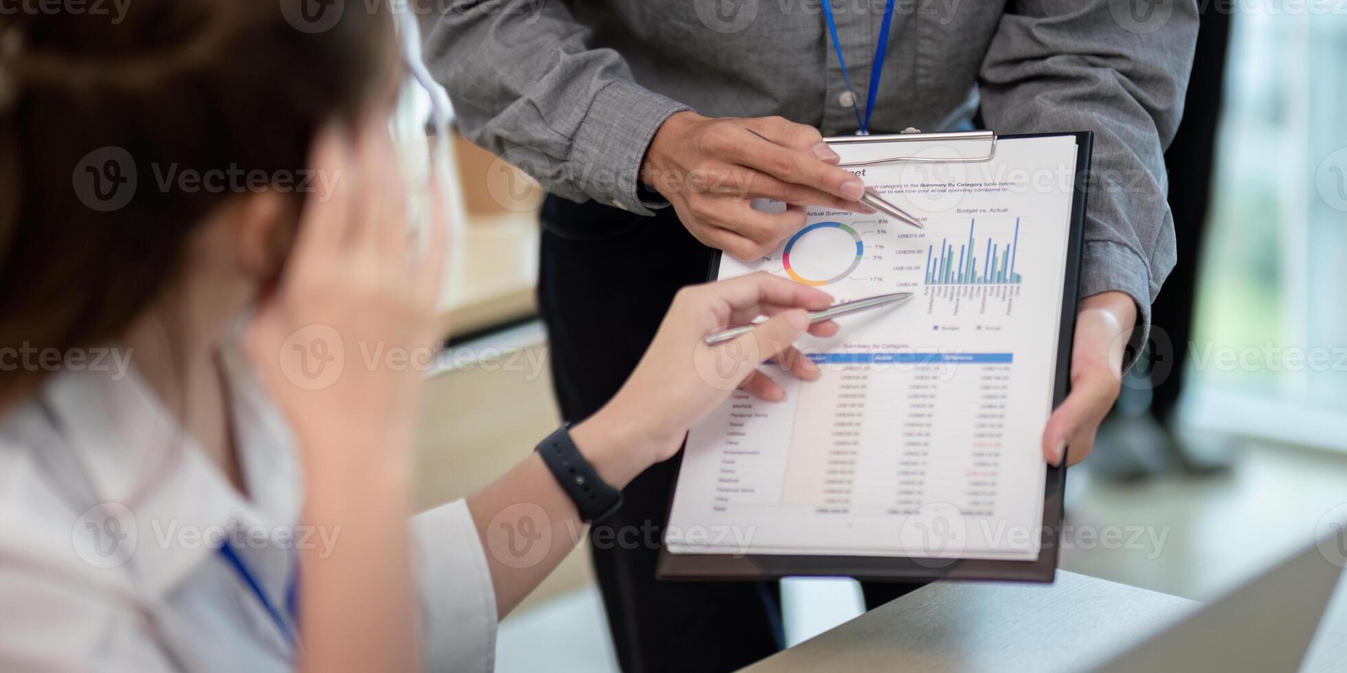 Business Team Analyze Data and discuss strategy in a Modern Office Environment with Charts and Graphs photo
