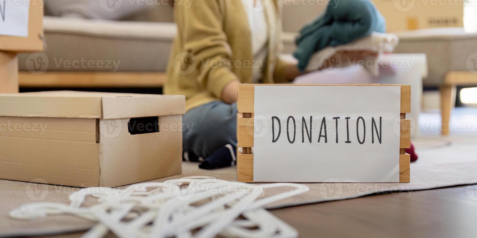 Volunteer Collecting and Donation Clothes for Charity. Community Service and Generosity in Action photo