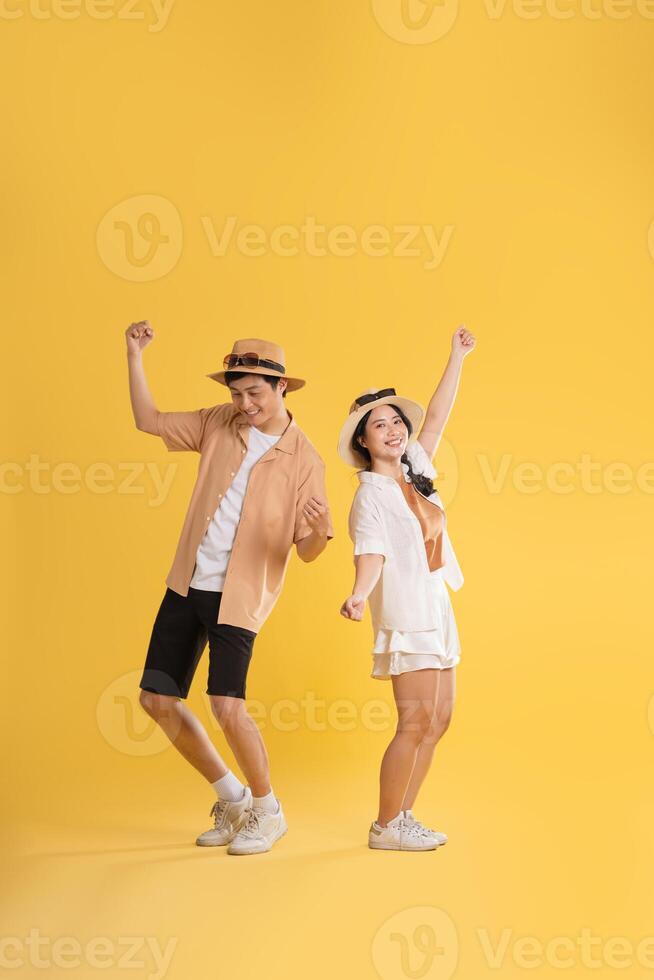 Portrait image of couple posing on yellow background, summer, travel photo