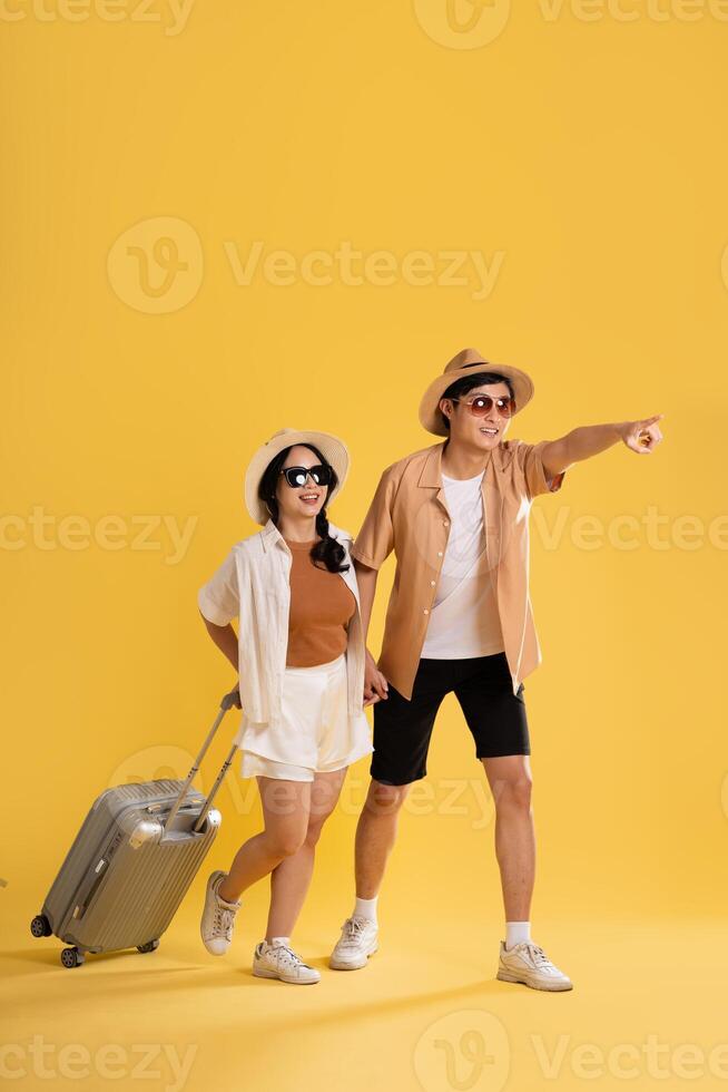 Portrait image of couple posing on yellow background, summer, travel photo