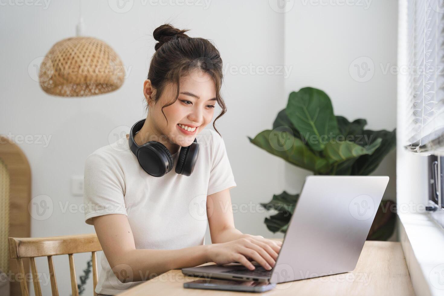 Portrait of asian girl working at home photo