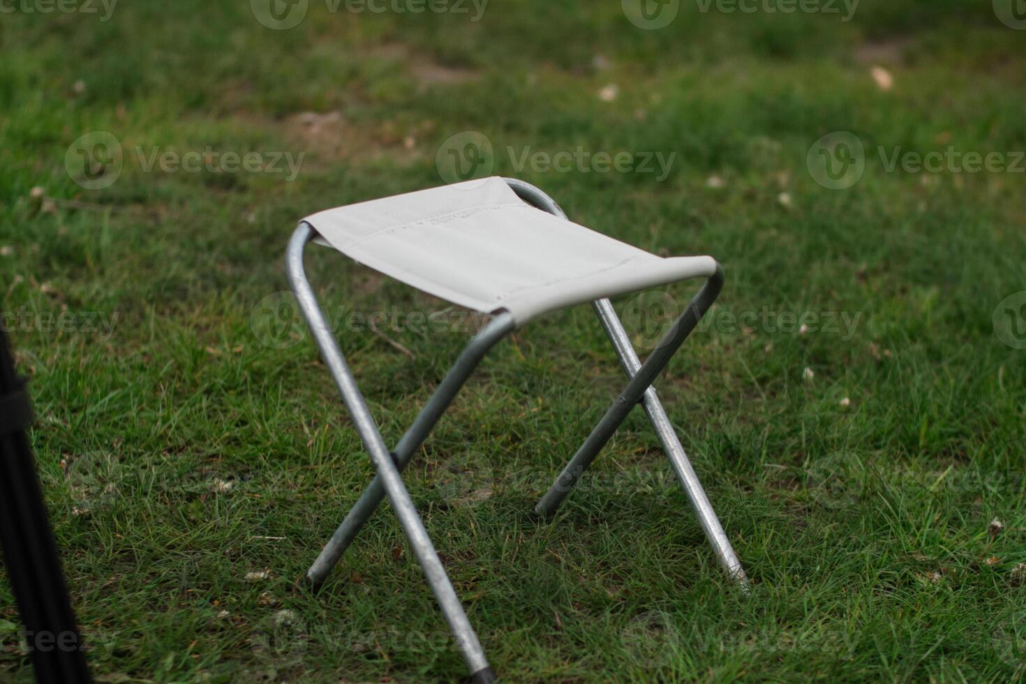 Folding Camping Chair Standing on Grass photo