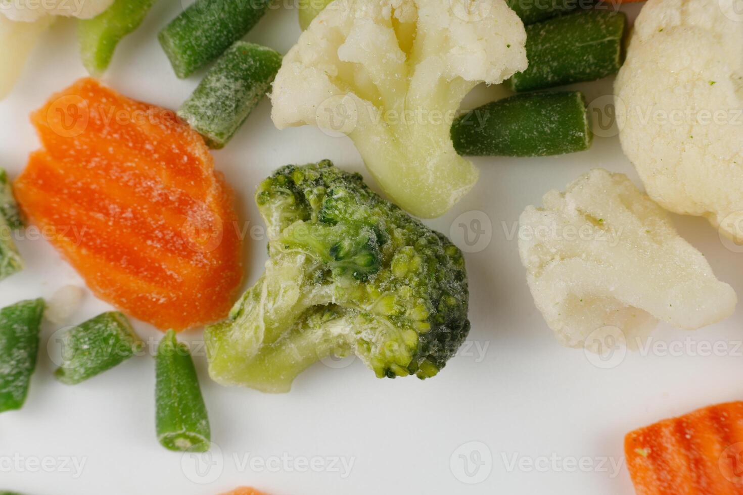 Frozen vegetables close-up on a white background. photo