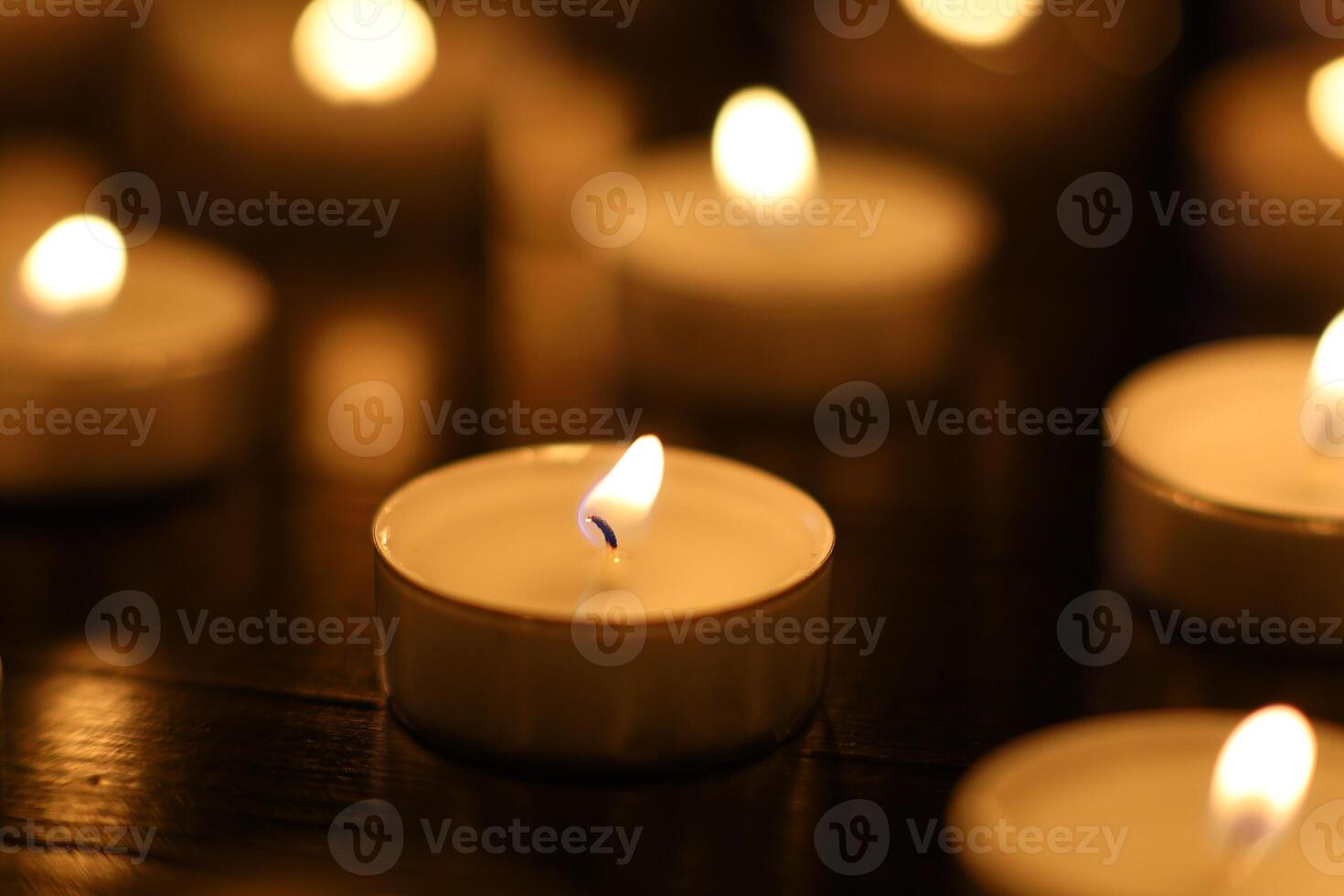 Many burning candles with shallow depth of field. candles in memory of the dead photo