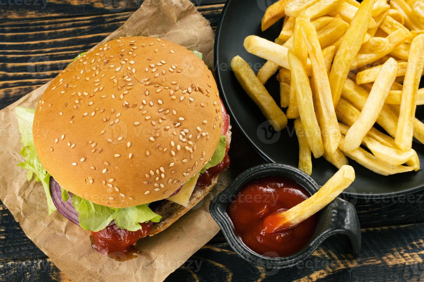 burger with French fries and sauce top view. photo
