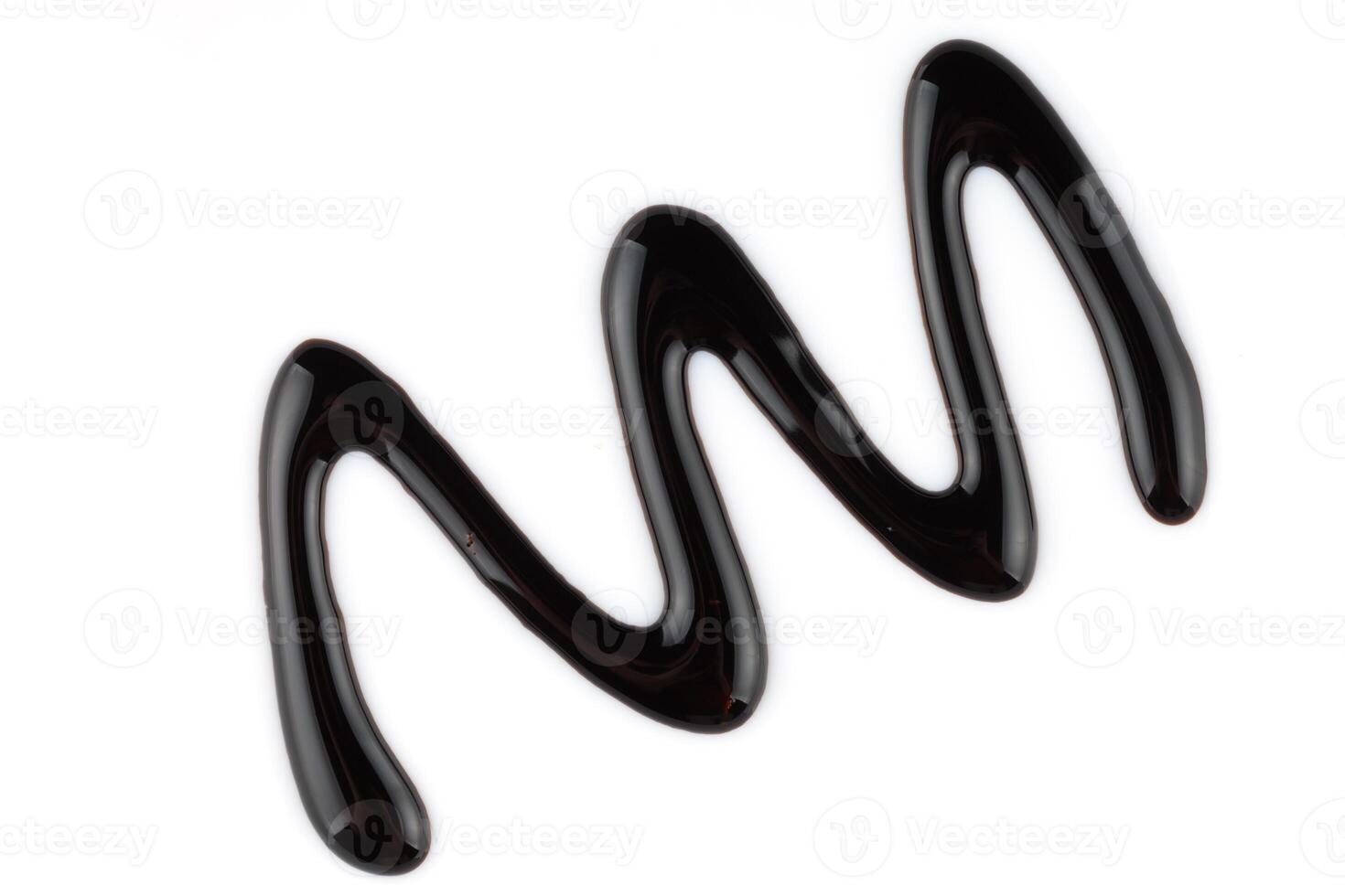 Chocolate topping on a white background isolate. Samples of liquid chocolate. photo