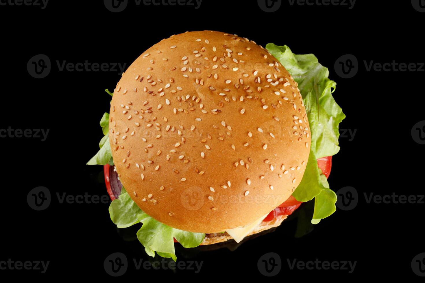 Burger appetizing top view on black. Meat hamburger flat lay photo