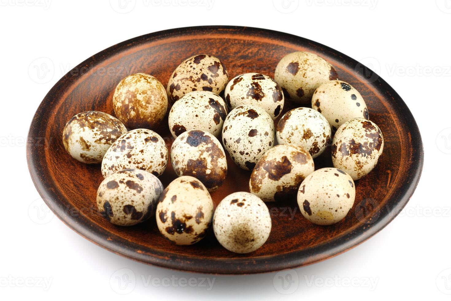 Quail eggs on a plate isolate. photo