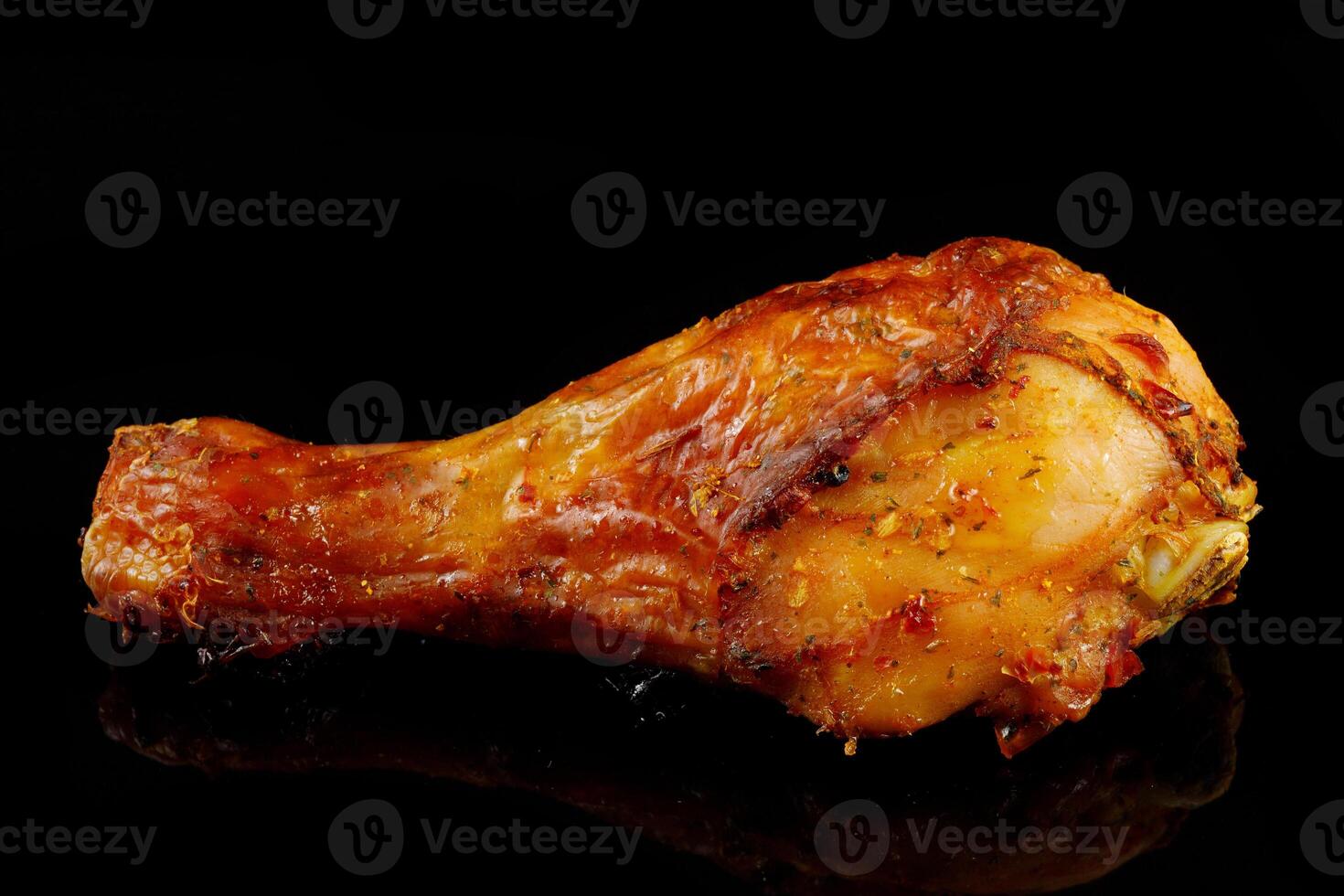 Fried chicken leg on black. photo