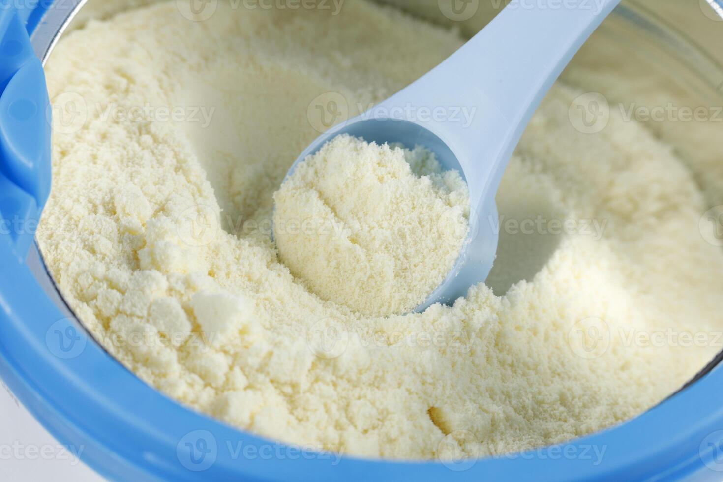 Sports nutrition in a jar. Protein powder. Whey protein powder in measuring scoop and jar photo