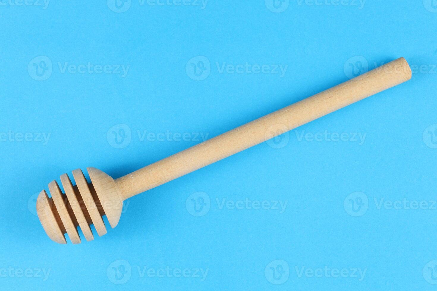 New and clean wooden honey stick. photo