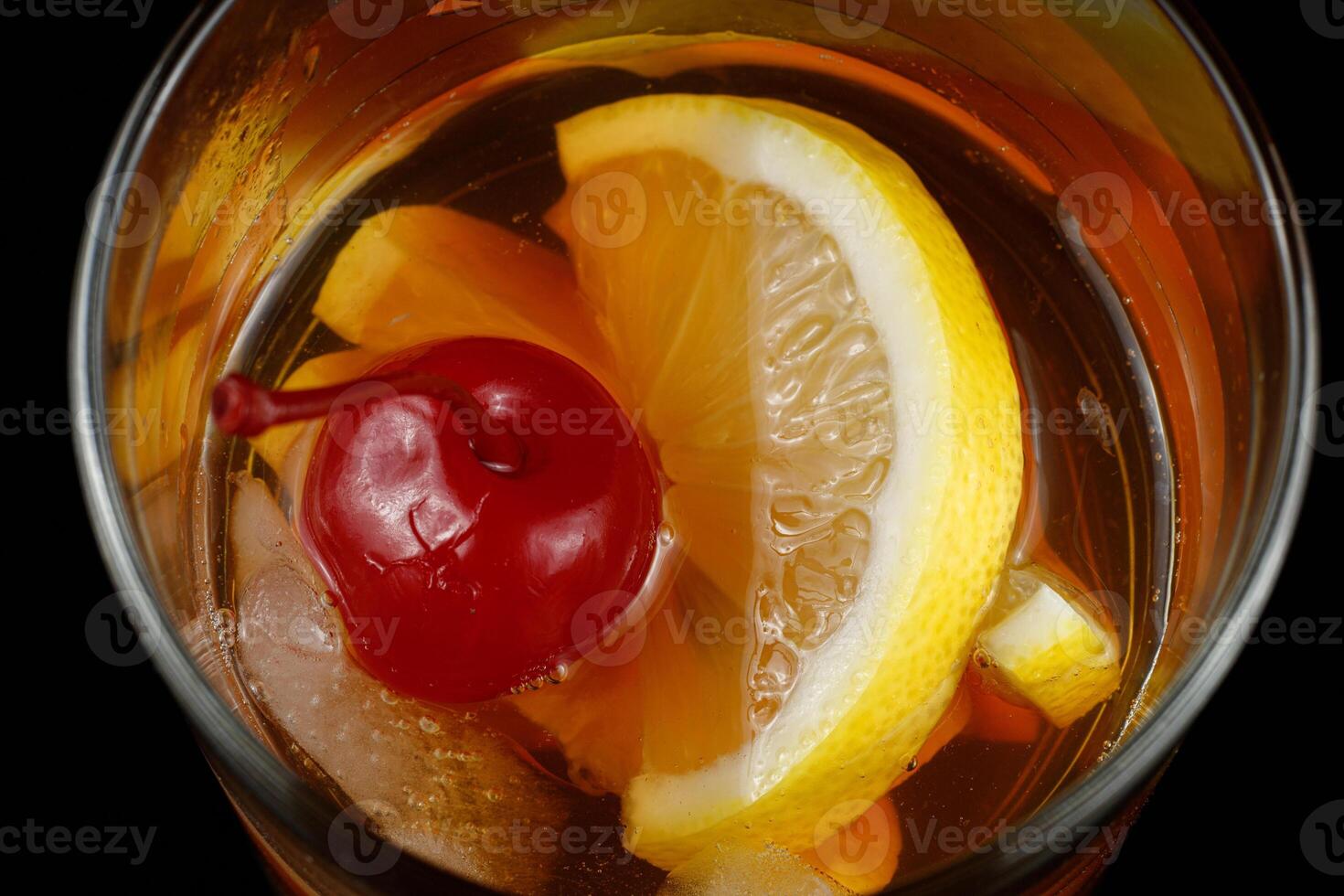 Tea with lemon and cherry. Cherry amaretto sours photo