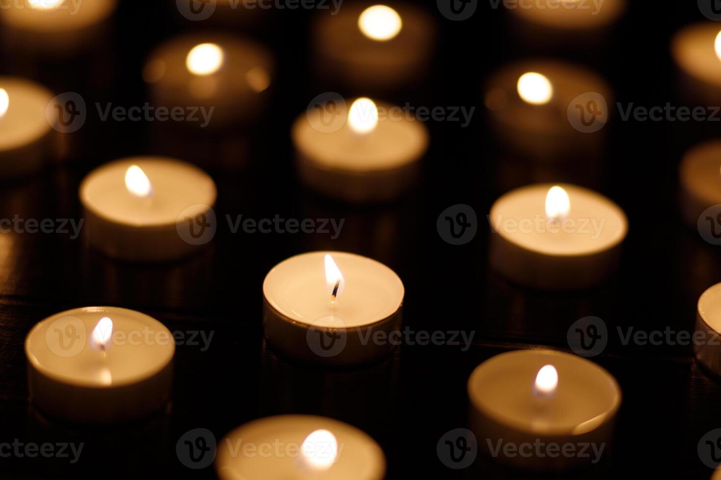 Many burning candles with shallow depth of field. photo