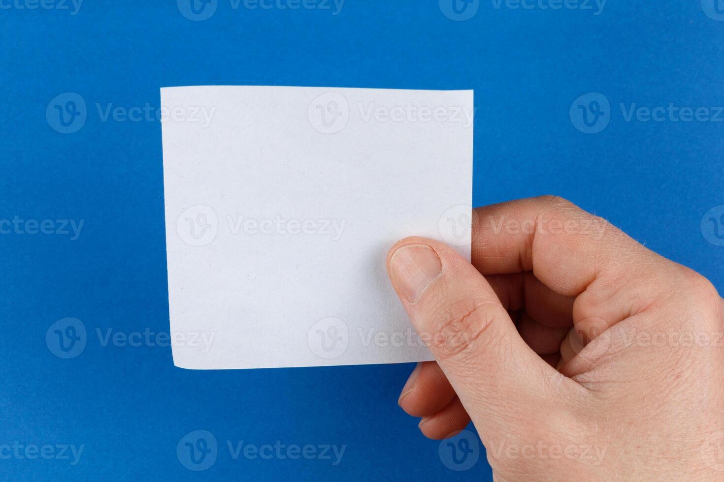 Hand holding blank sticker place for text cope space photo