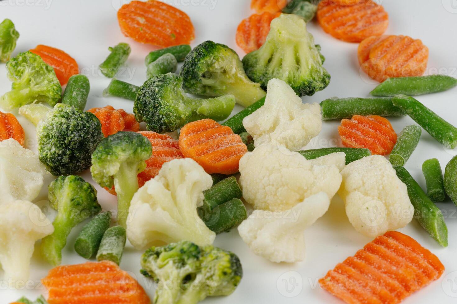 Frozen vegetables close-up on a white background. photo