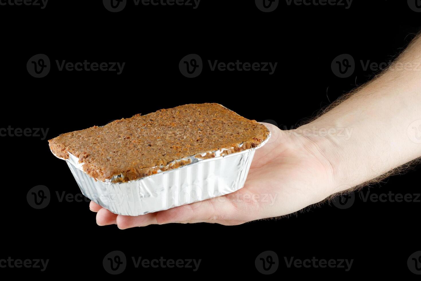 Liver pate in a container in hand photo
