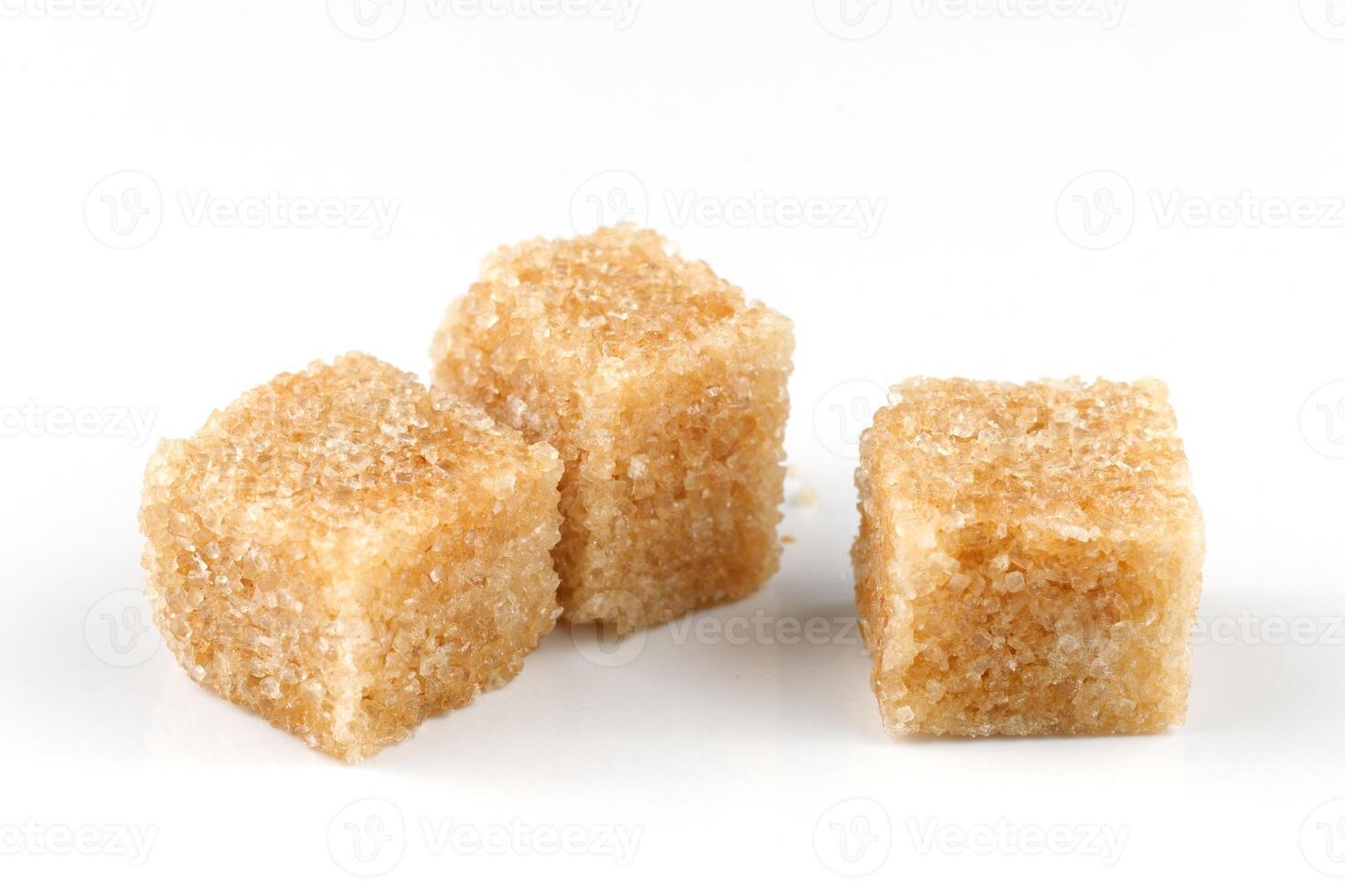 Three pieces of brown sugar isolate. Cane sugar. photo
