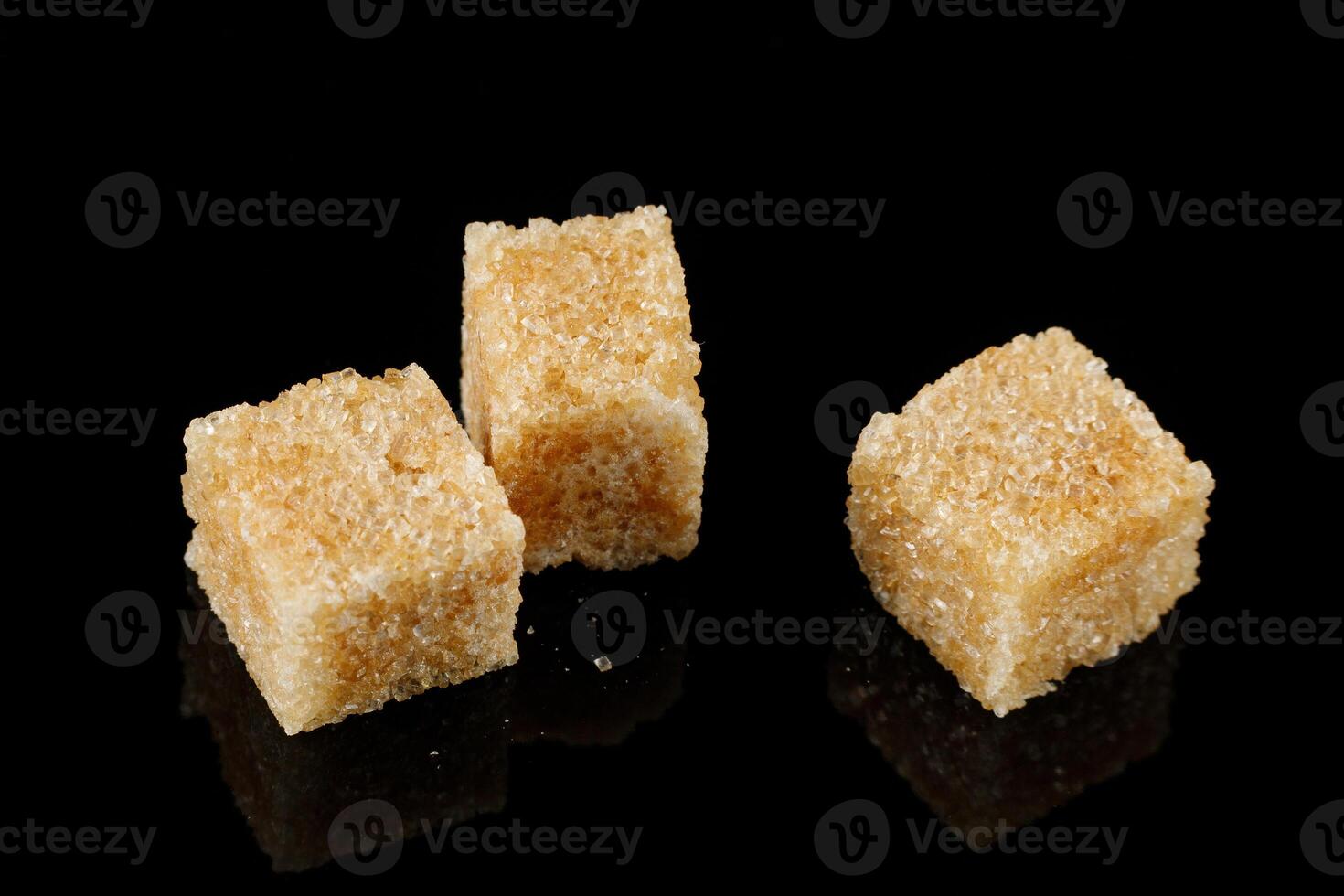 Three pieces of brown sugar isolate. Cane sugar. photo