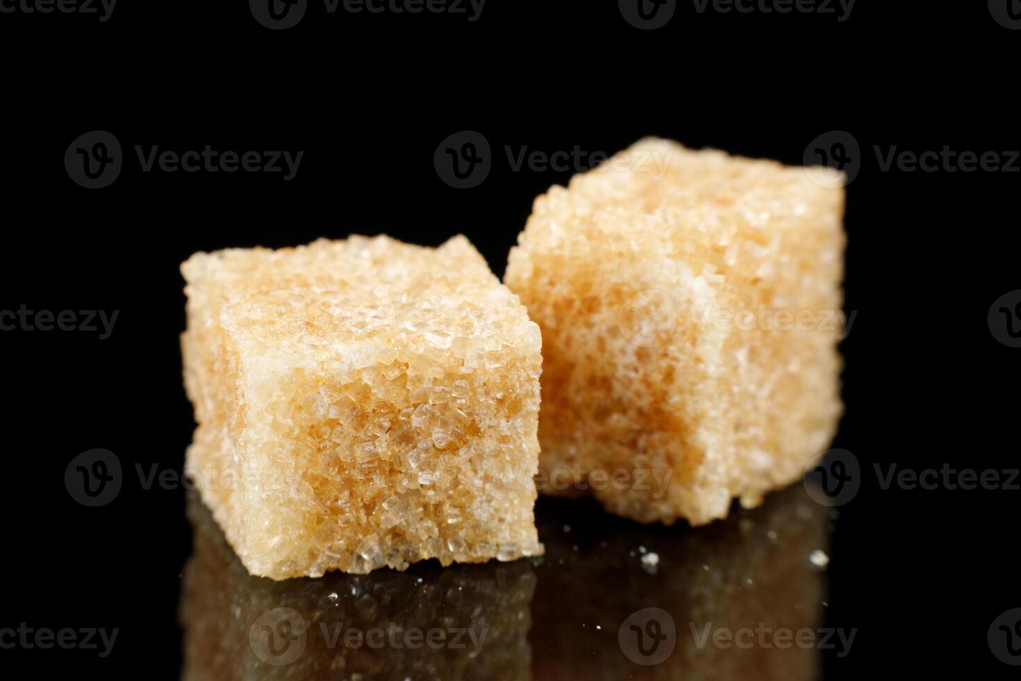 Two pieces of brown sugar. Cane sugar. photo