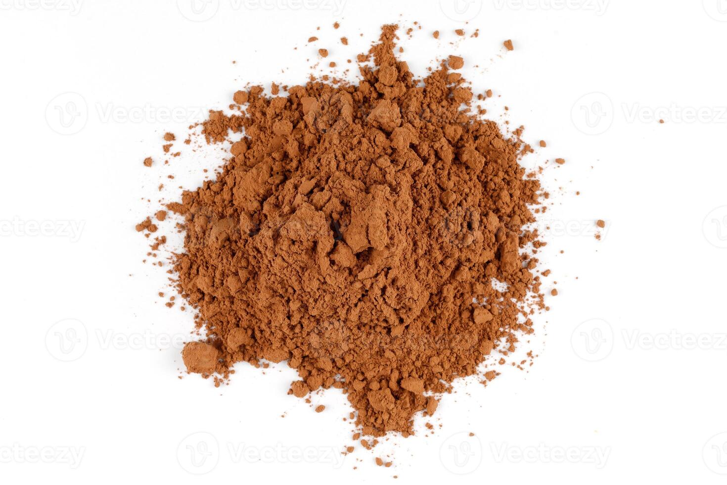 Cocoa powder heap on white isolate photo