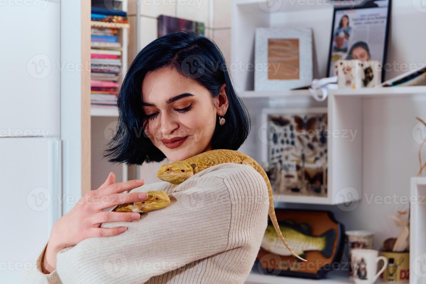 Beautiful Woman Posing with Her Two Adorable Bearded Dragon Pets photo