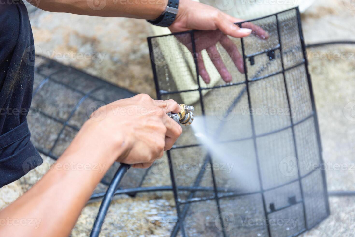 Repairman washed the dirty air conditioner filter, Technician cleaned mold in the air conditioning system, Maintenance and service concepts photo
