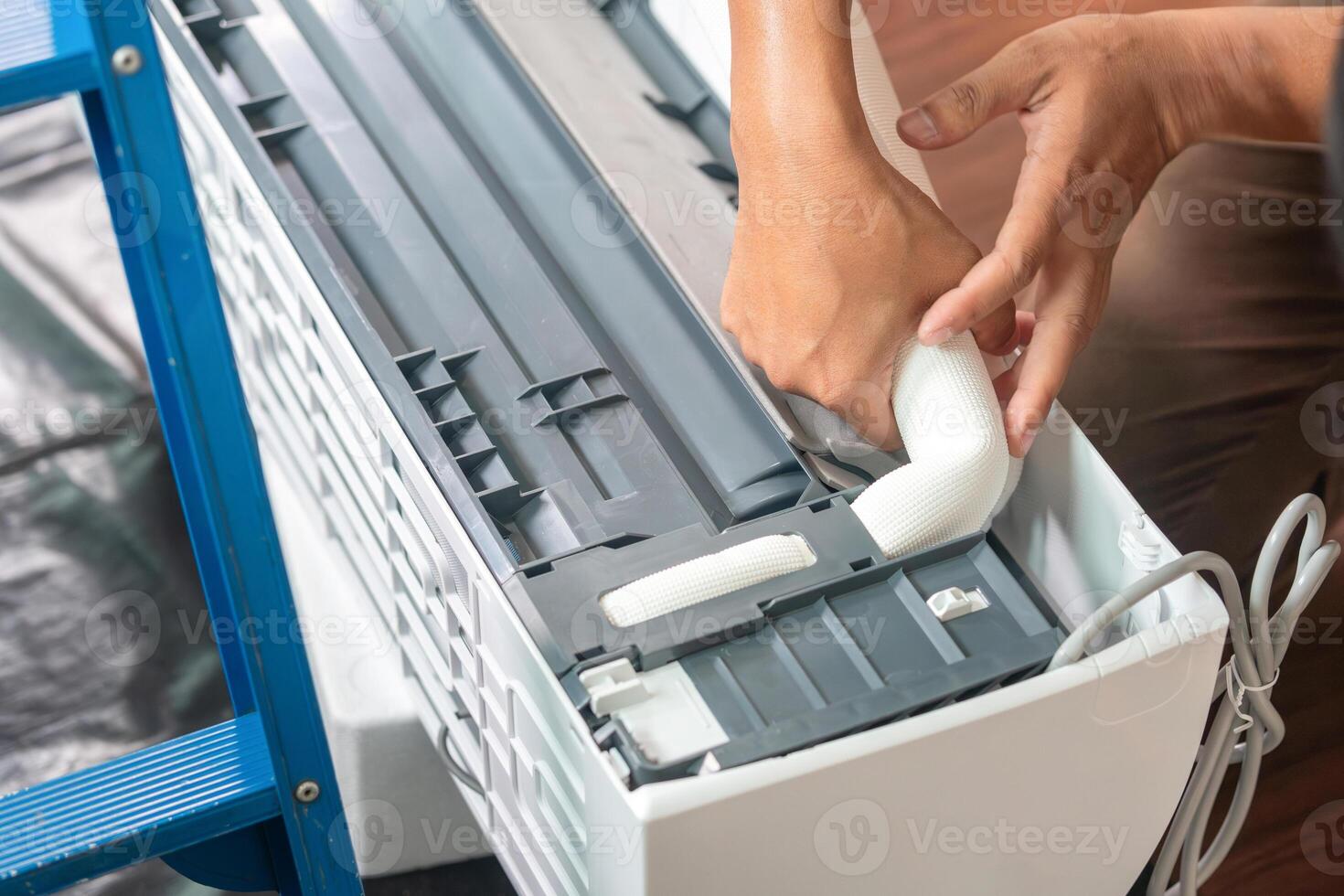 Repairman service for repair and maintenance of air conditioners, Technician team install new air conditioner photo