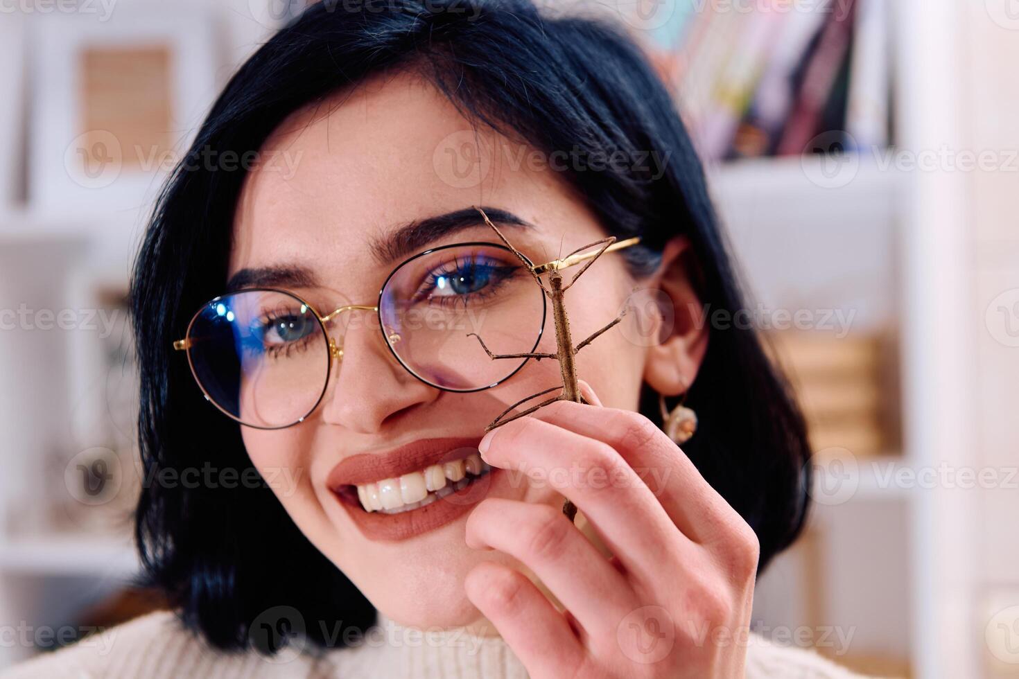 Young Woman Captured in a Beautiful Moment with Her Stick Insect , Medauroidea Extradentata photo