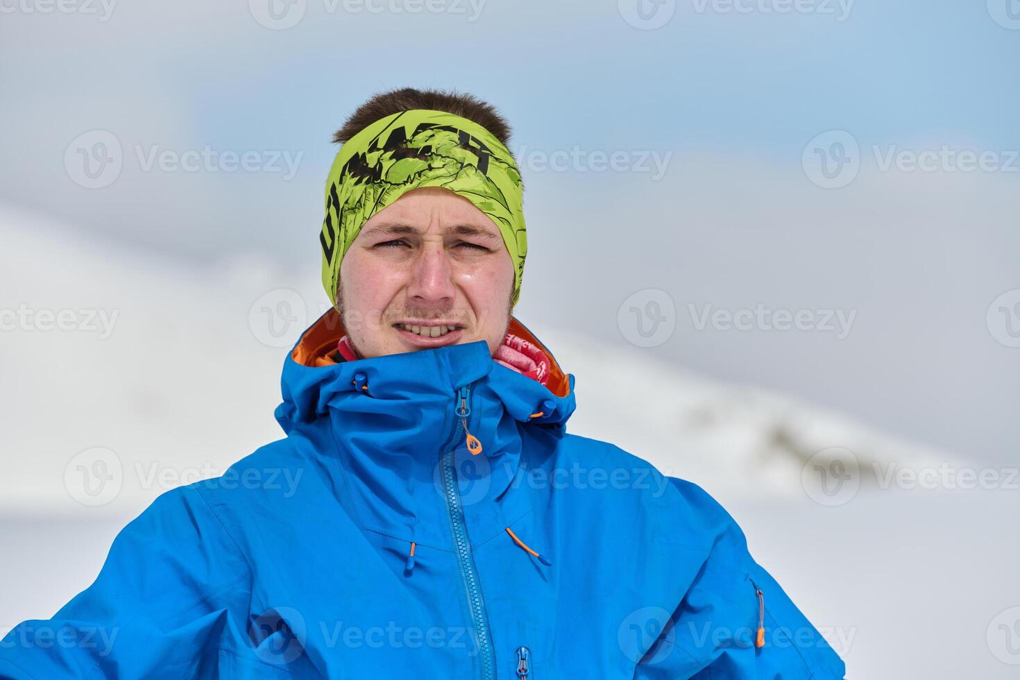 Portrait of a Professional Skier's Blissful Relaxation atop the Snowy Alps photo