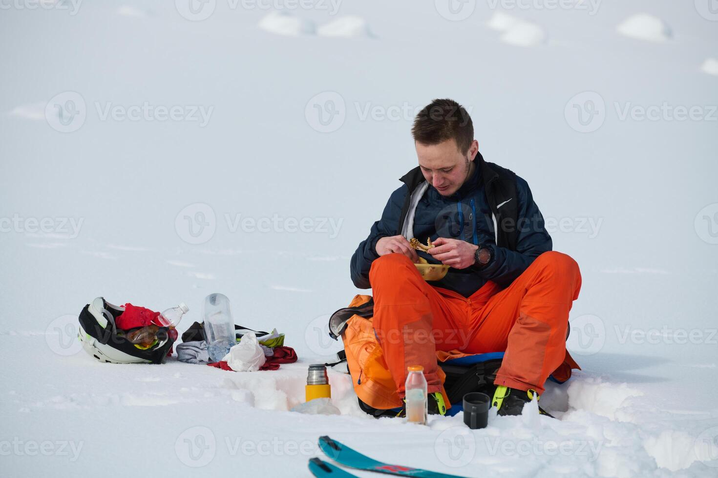 A Skier Takes a Well-Deserved Break to Enjoy the View photo