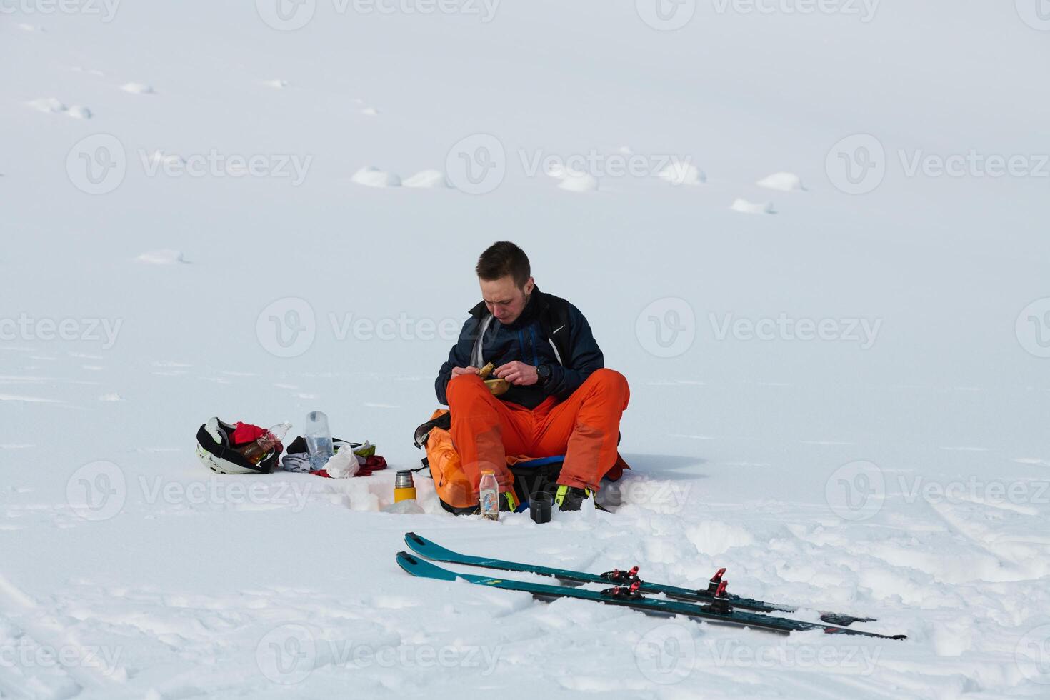 A Skier Takes a Well-Deserved Break to Enjoy the View photo