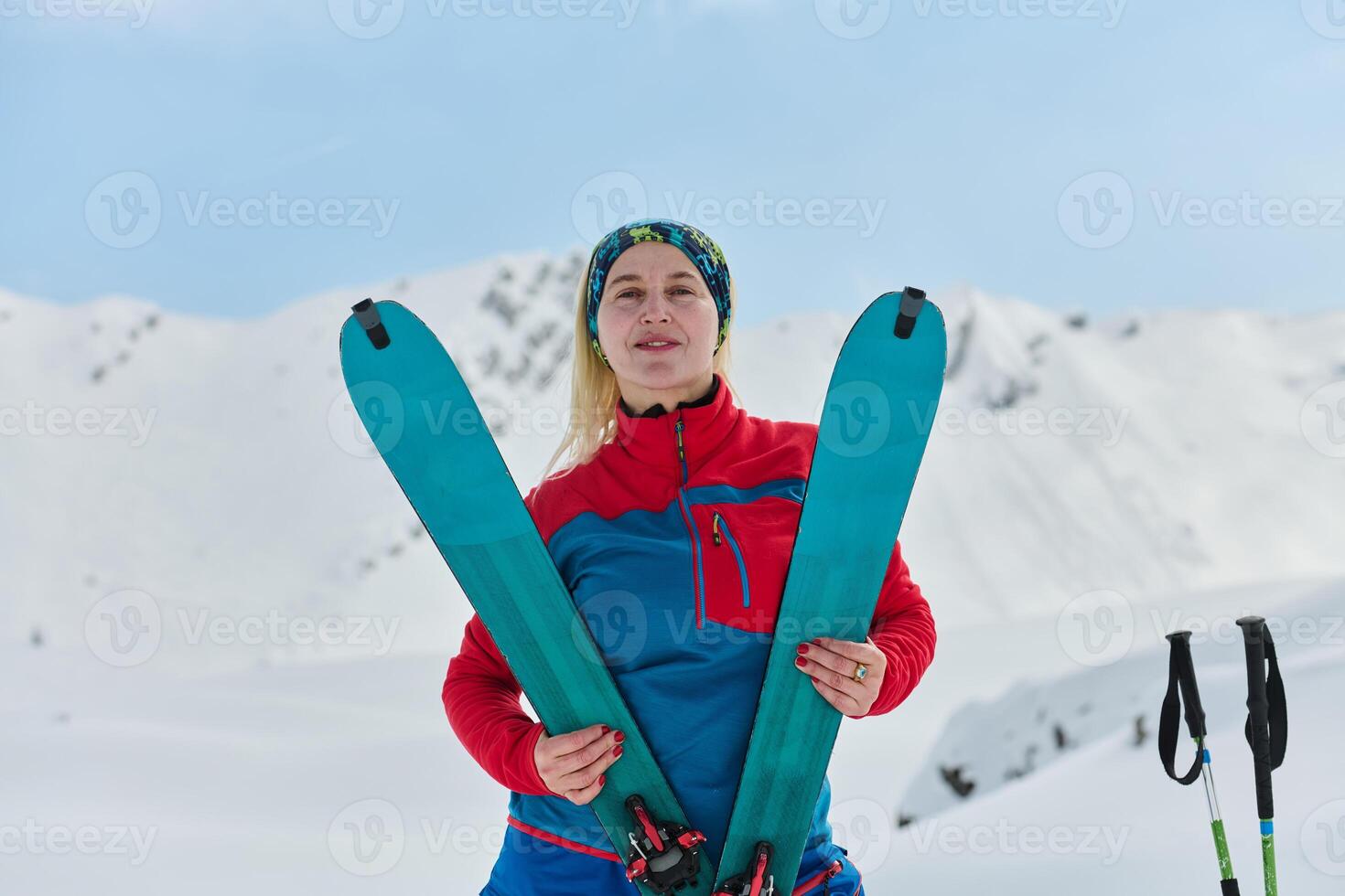 Conquering the Peak. Confident Skier Celebrates Success photo