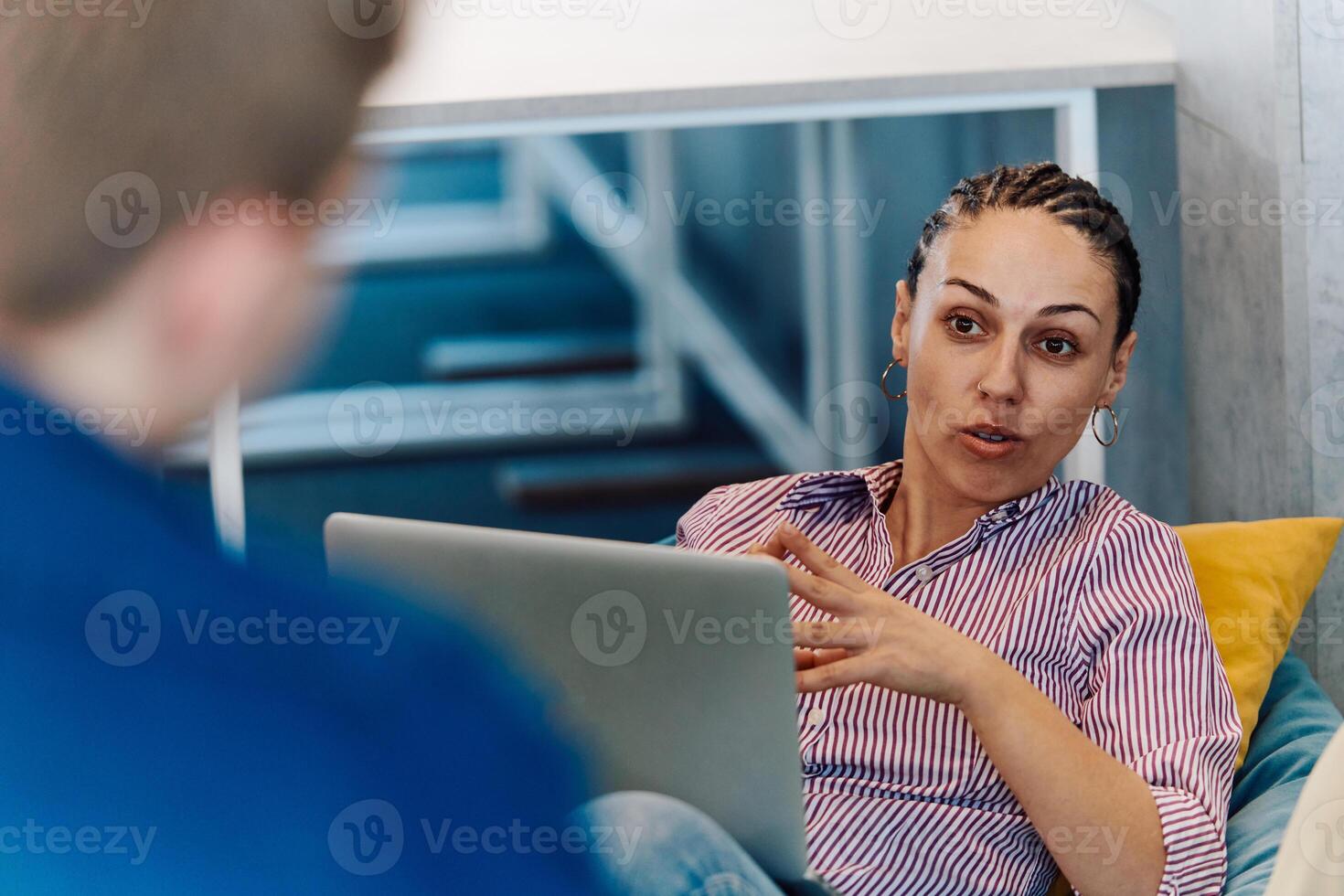A modern programmer discussing future business projects with colleagues in a modern startup office photo