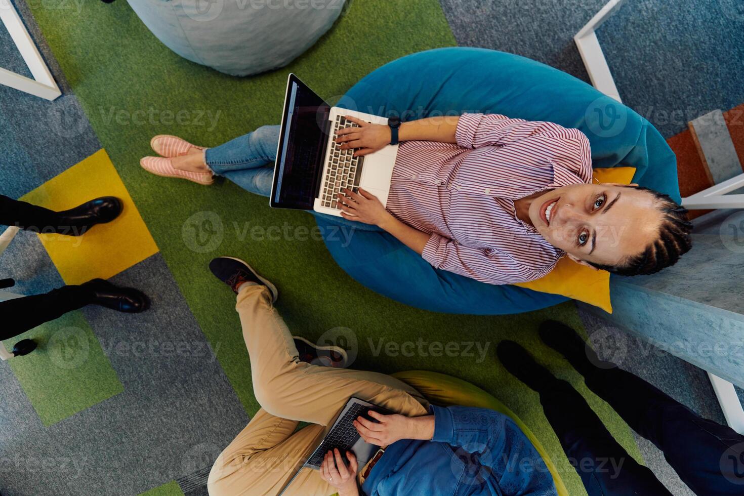 Top view photo of collaborative process of multicultural skilled young business team during brainstorming meeting in office.Diverse group of young people dressed in formal wear cooperating on